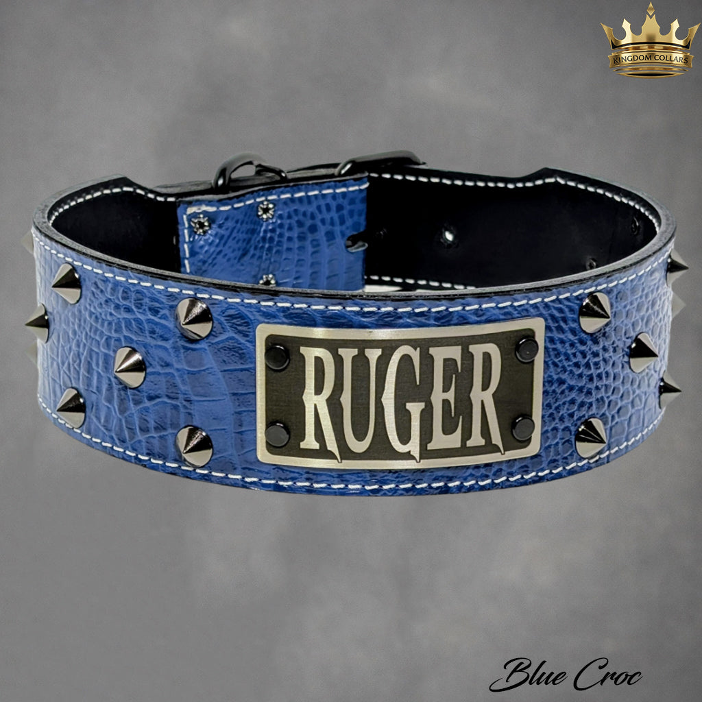 Blue leather dog collar with 'RUGER' engraving on a gray background