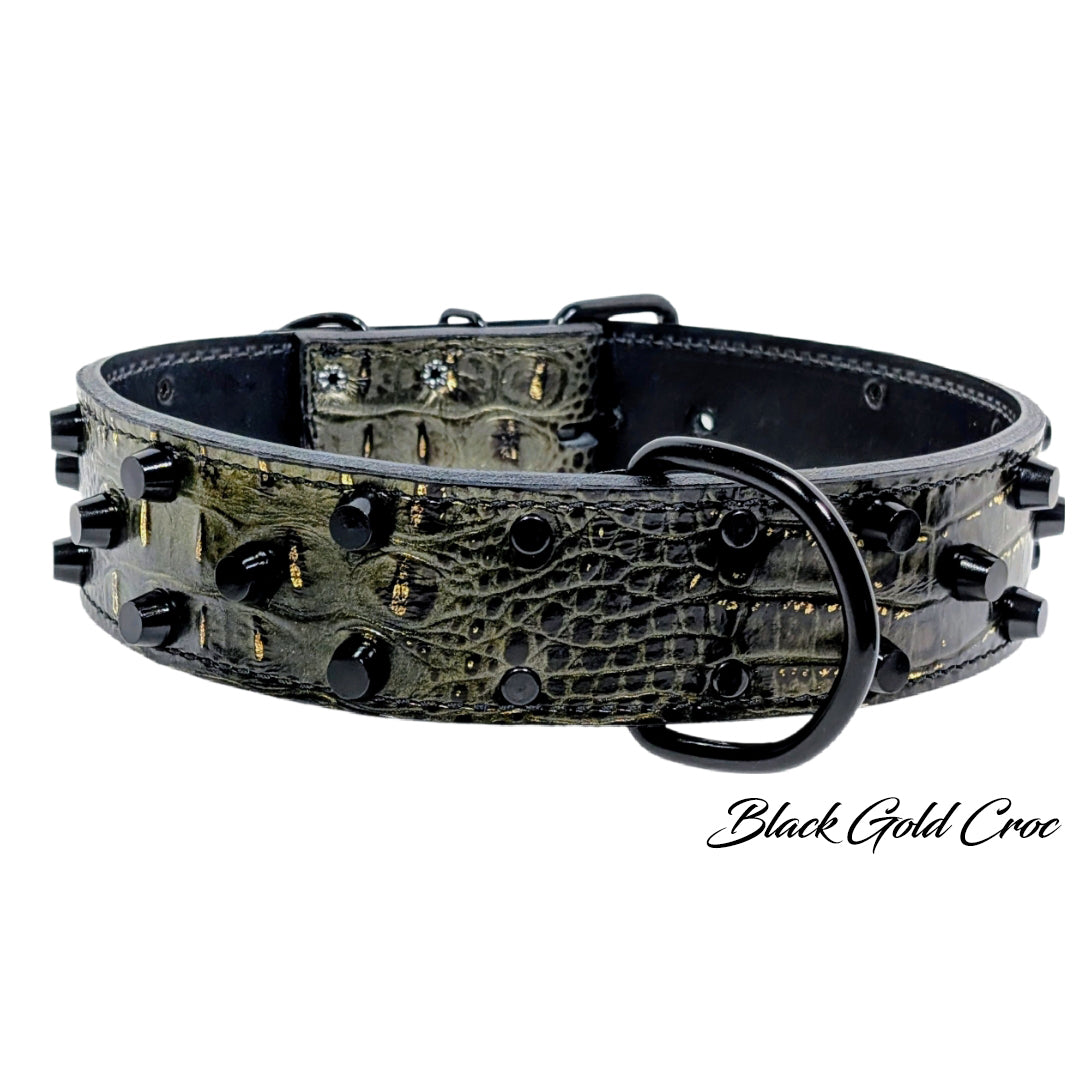 Black and gold crocodile-patterned dog collar on a white background